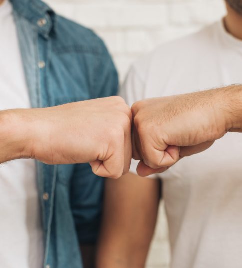 close-up-of-male-friend-touching-fist